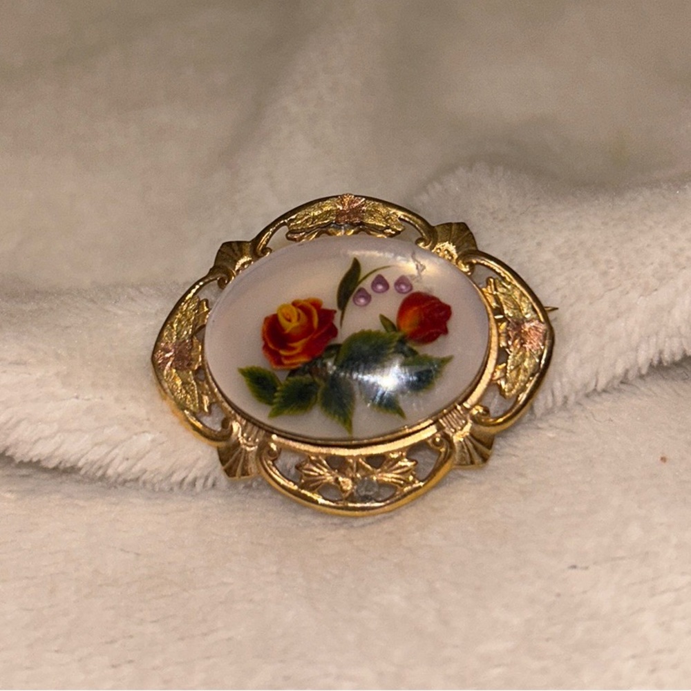 resin gem tone hand carved brooch.